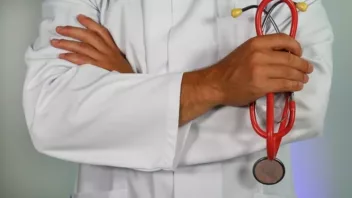 close up of a doctor holding a stethescope